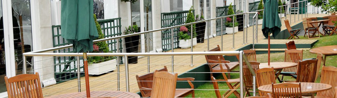 Modular Wire Rope Infill System installed at edge of wooden decking at the Chelsea flower show